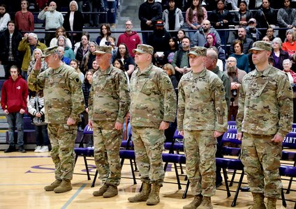 Brig. Gen. Lenny Williams, Assistant Adjutant General – Army, and Commander of the Illinois Army National Guard, renders a salute to Company C 1st Sgt. Dylan Short, during the unit’s mobilization ceremony Feb. 9 in Litchfield.