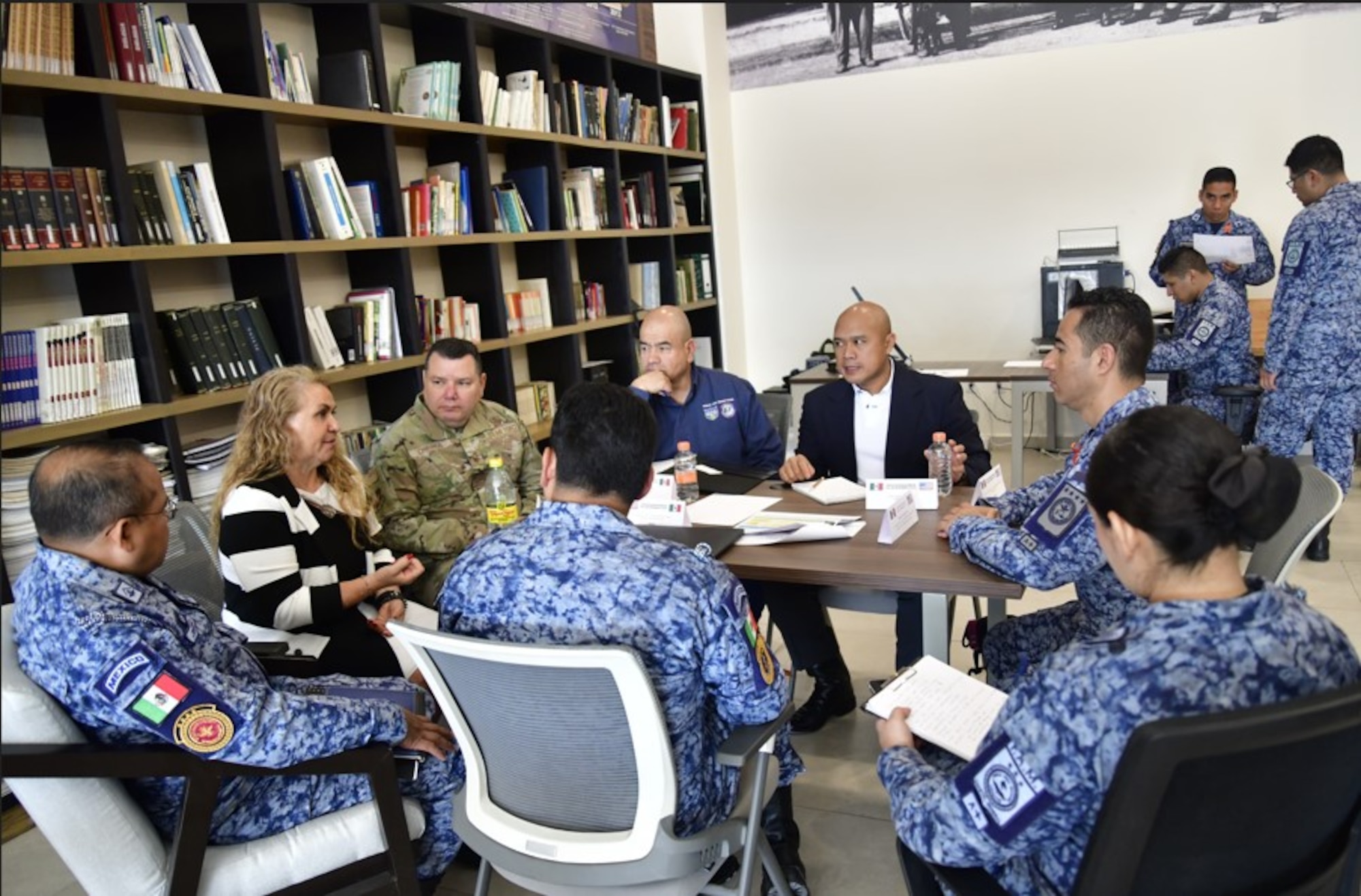 U.S. and Mexican Air Force participants sitting at a table, discussing how to strengthen their collaboration and tackle shared challenges at the 2024 Air Force Staff Talks (AFST) between the US and Mexican Air Forces.