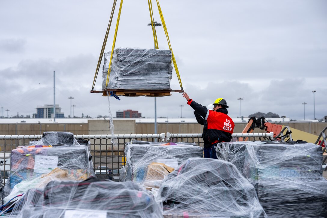 U.S. Coast Guard Cutter Waesche (WMSL 751) crewmembers offload bales of seized narcotics in San Diego, Feb. 13, 2025. The drugs, worth an estimated $275 million, were seized in international waters of the Eastern Pacific Ocean. (U.S. Coast Guard photo by Petty Officer 3rd Christopher Sappey)