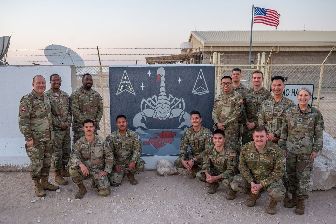 Military members stand in a group