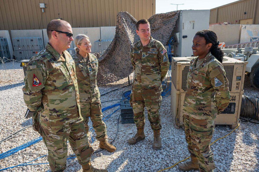 Military members stand in a group