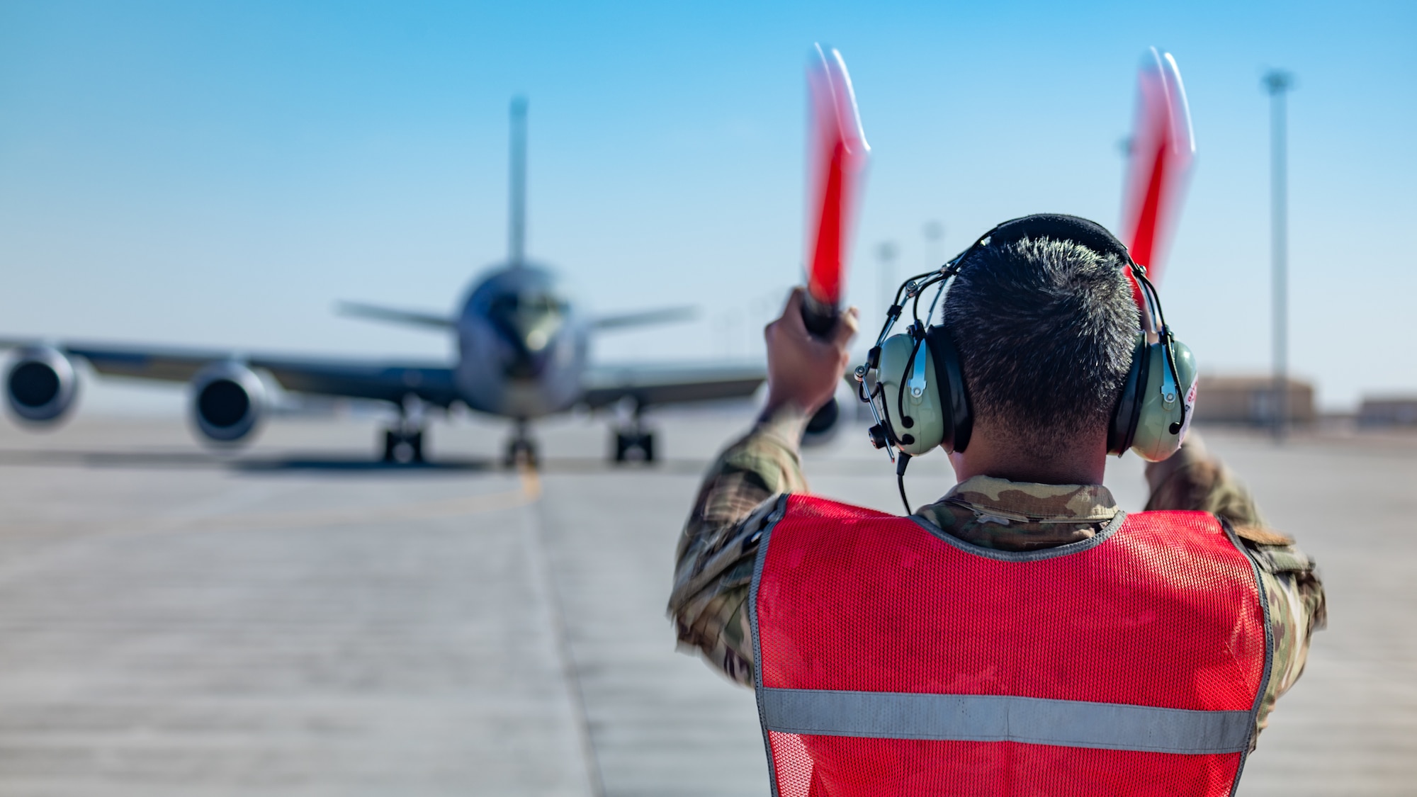 An Airman marshals a KC-135