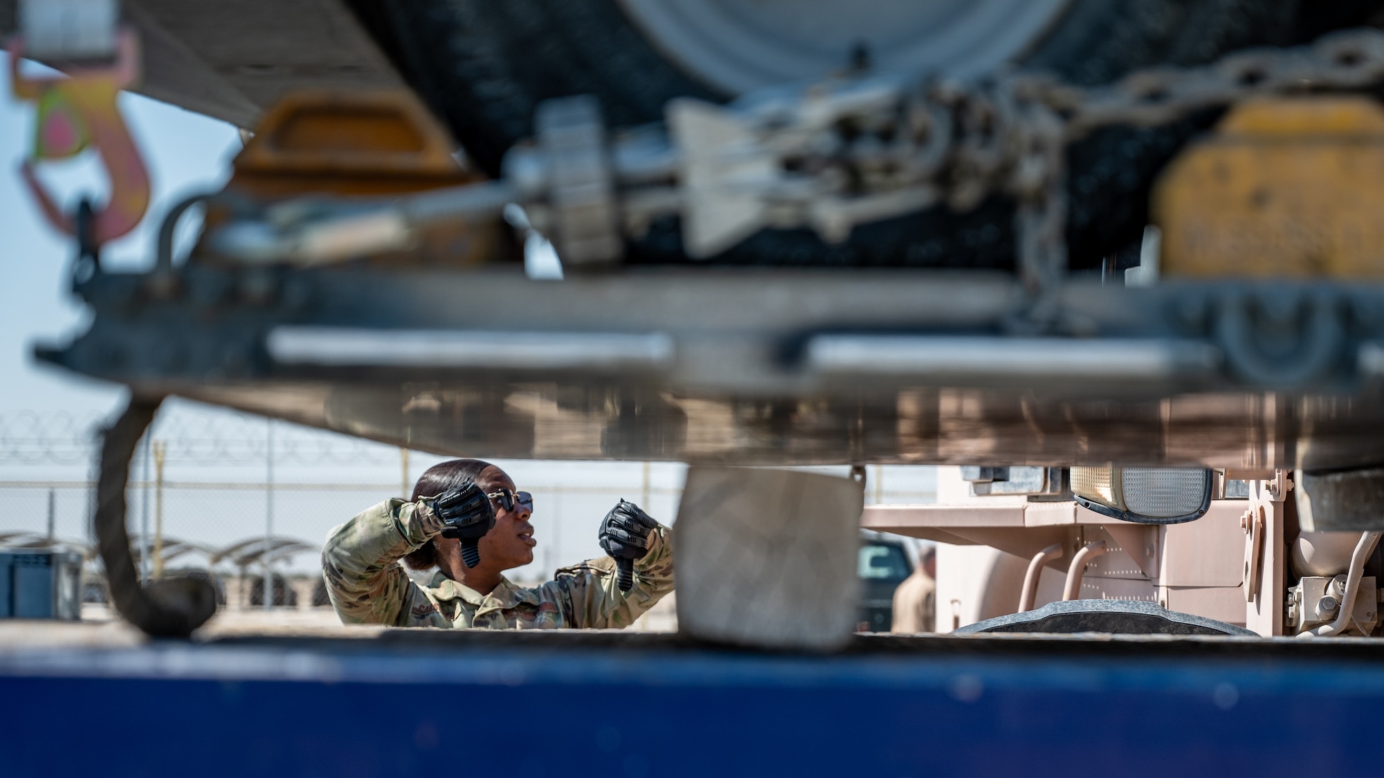 An Airman spots for a forklift
