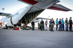 U.S. Coast Guardsmen assigned to tactical law enforcement teams work alongside U.S. Customs and Border Protection personnel to facilitate the disembarkation of aliens from a Coast Guard HC-130 Hercules airplane in El Paso, Texas, Feb. 2, 2025. Alien expulsion flights continue the Coast Guard’s actions to enforce the immigration laws of the U.S. in accordance with the president’s executive orders. (U.S. Coast Guard photo, courtesy Air Station Barbers Point)
