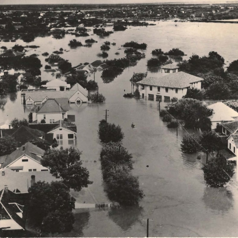 An aerial view of San Angelo during the floods of September 1936. This flood, and others like it over the previous decade, led to the authorization of O.C. Fisher Dam and Lake by the Flood Control Act of 1941. Since its completion, through fiscal year 2023, the cumulative amount of damages prevented by the dam during rain events is $21.3 million.