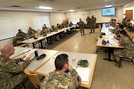 Col. Jeremy Coleman, commander of the 213th Regional Support Group, addresses a meeting of Soldiers who were participating in a Warfighter exercise at Fort Indiantown Gap. More than 100 Soldiers from the 213th RSG provided real-life support for the exercise. (Courtesy photo)