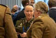 U.S. Army Reserve Lt. Col. Joy Sanders, the international programs manager for Army Reserve Medical Command out of Pinellas Park, Fla., listens to a British army officer during a luncheon for the Confédération Interalliée des Officiers Médicaux de Réserve, also known as the Interallied Confederation of Medical Reserve Officers and by its French acronym CIOMR, Mid-Winter Meeting 2025 at the NATO HQ in Brussels, Jan. 30, 2025. Sanders served as the chief liaison to connect AR-MEDCOM Soldiers and other U.S. Armed Forces reserve personnel with their NATO nation counterparts to establish interoperability and collaborative synchronization. (U.S. Army Reserve photo by Sgt. 1st Class Christopher Hernandez)