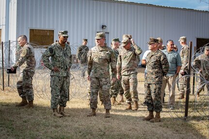 Admiral Holsey visits illegal aliens holding operations center at Guantanamo Bay