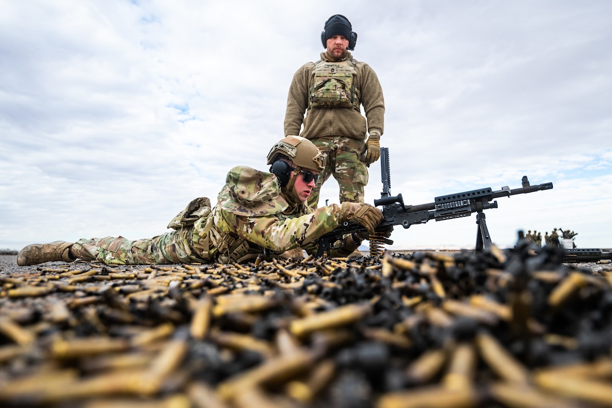 Senior Airman Henry Maddock, 375th Security Forces Squadron patrolman, fires an M240 light machine gun during 12th Air Task Force training on Camp McGregor, N.M., Jan. 16, 2025. Led by the 12th Combat Air Base Squadron and cadres from U.S. Army TF Black Scorpion, 2-363rd Training Support Battalion, 12th ATF Airmen from Scott, Barksdale, and Little Rock Air Force bases and Joint Base Langley-Eustis conducted combat-focused training to ensure joint force maneuver in combat and mission readiness. (U.S. Air Force photo by Senior Airman De'Quan Simmons)