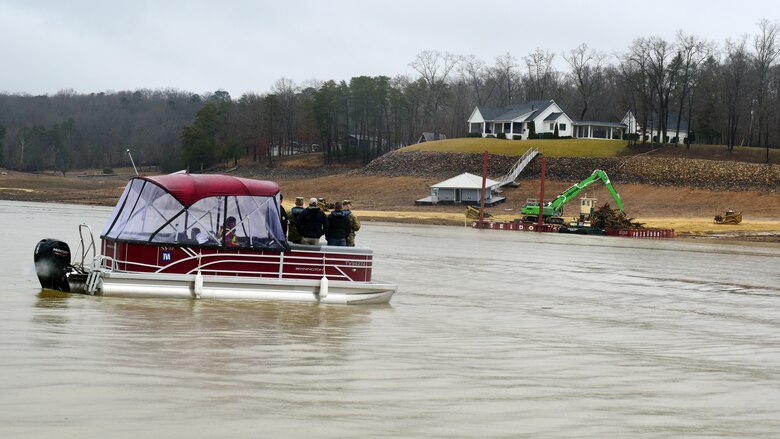U.S. Army Corps of Engineers Command Sgt. Maj. Douglas Galick joins Hurricane Helene Response partners on Douglas Lake in Dandridge, Tennessee, to review operations Feb. 12, 2025, at a debris collection site on the shoreline. USACE is providing technical assistance in support of the debris mission. (USACE Photo by Lee Roberts)
