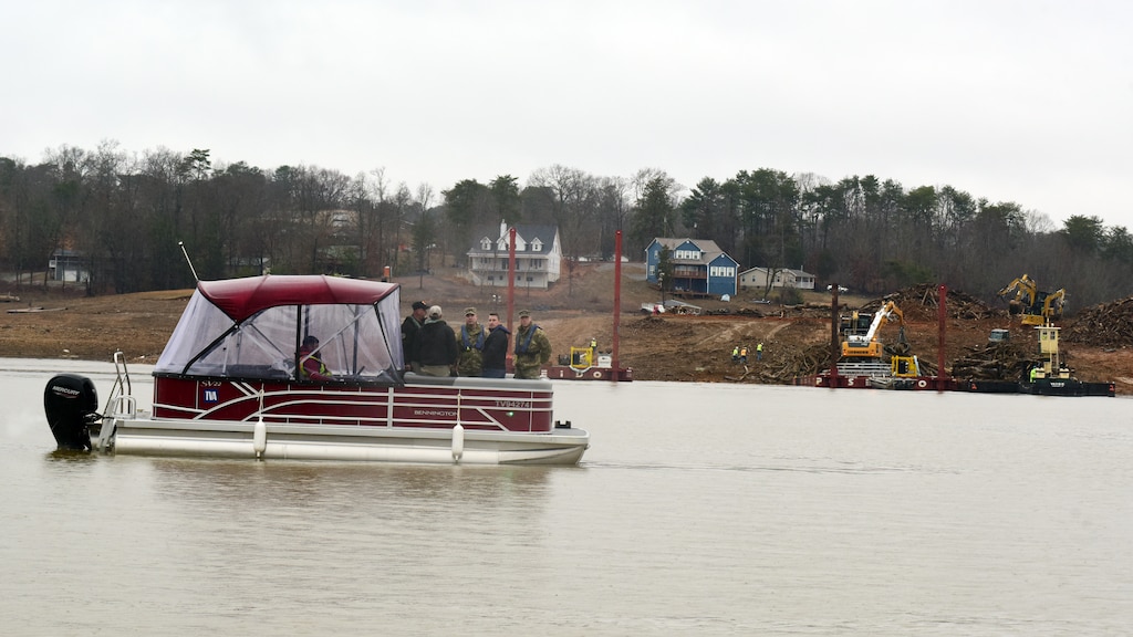 U.S. Army Corps of Engineers Command Sgt. Maj. Douglas Galick joins Hurricane Helene Response partners on Douglas Lake in Dandridge, Tennessee, to review operations Feb. 12, 2025, at a debris burn site on the shoreline. USACE is providing technical assistance in support of the debris mission. (USACE Photo by Lee Roberts)