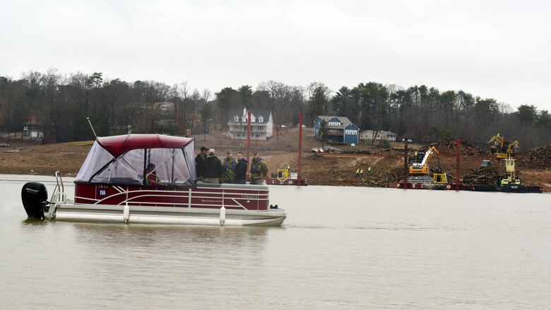 U.S. Army Corps of Engineers Command Sgt. Maj. Douglas Galick joins Hurricane Helene Response partners on Douglas Lake in Dandridge, Tennessee, to review operations Feb. 12, 2025, at a debris burn site on the shoreline. USACE is providing technical assistance in support of the debris mission. (USACE Photo by Lee Roberts)