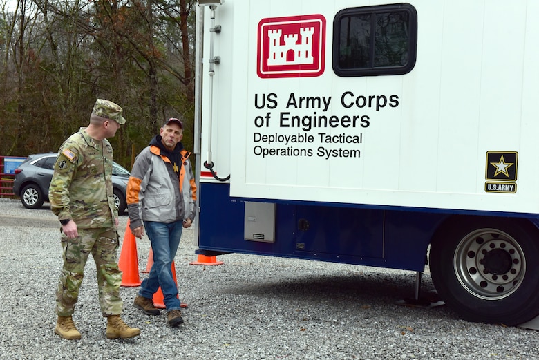 Jerry Breznican, U.S. Army Corps of Engineers Nashville District Emergency Management chief, briefs USACE Command Sgt. Maj. Douglas Galick Feb. 12, 2025, about Hurricane Helene debris operations at the Emergency Command and Control Vehicle on the shoreline of Douglas Lake in Dandridge, Tennessee. (USACE Photo by Lee Roberts)