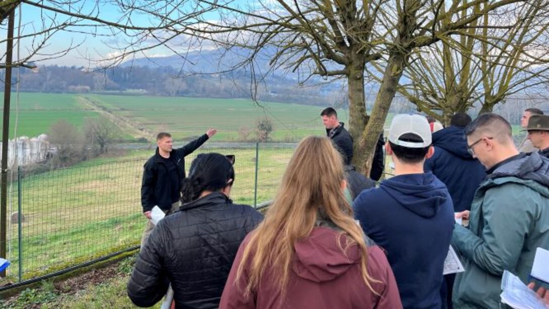 SAW European Staff Ride:  Maj Fields, USMC leads a guided discussion focusing on Allied attempts to cross the Rapido River and penetrate German lines in Jan 1944.  Photo taken from Remo’s with the Rapido River and the town of San Angelo in the background.