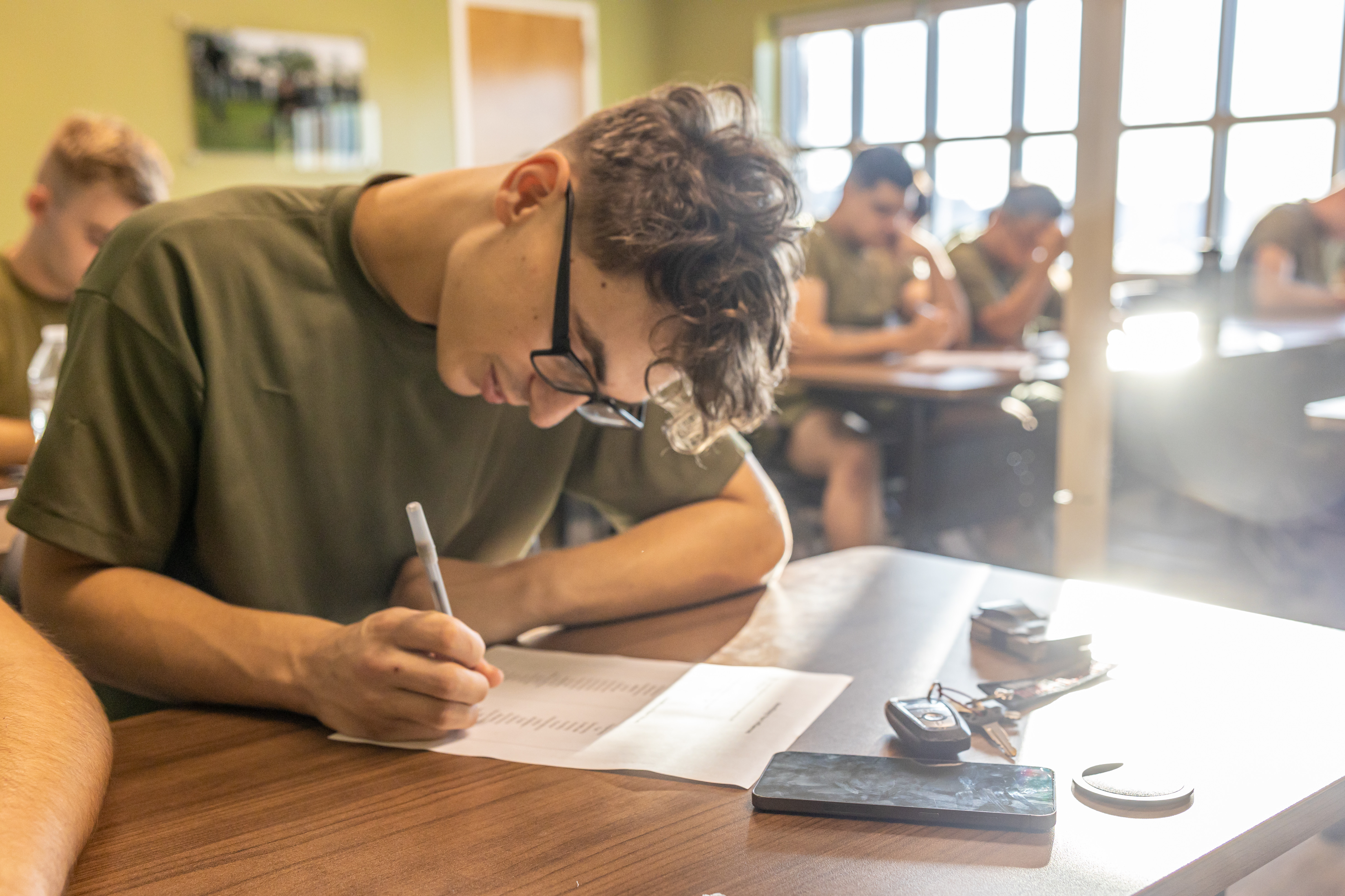A U.S. Marines with Combat Logistics Battalion 22, Combat Logistics Regiment 27, 2nd Marine Logistics Group, takes notes during spiritual health training held at the 2nd MLG Human Performance on Camp Lejeune, North Carolina, Sept. 18, 2024. The HPC is conducting a 12-week program consisting of initial baseline assessments, surveys, and in-briefs with the remaining weeks spent on physical training sessions and classes to help CLB-22 improve in all domains of Marine Corps Total Fitness.