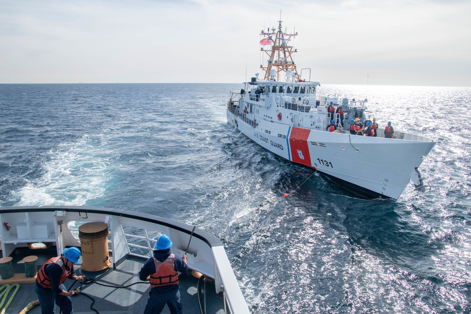 U.S. Coast Guard Cutter Active (WMEC 618) crewmembers conduct a towing and astern refueling exercise with U.S. Coast Guard Cutter Terrell Horne (WPC-1131), a 154-foot fast response cutter homeported in Los Angeles -Long Beach, California, while the cutters patrol the Pacific Ocean, Jan. 21, 2025. Active’s crew returned to their Port Angeles, Washington, homeport after patrolling over 5,500 miles off the coast of California in support of the Coast Guard District 11’s Operation Baja Tempestad which uses an interagency approach to conduct detection, monitoring, interdiction, and apprehension operations to counter Transnational Criminal Organization activity in the Coastal California Region, and the United States Pacific maritime southern border including alien interdiction operations. (U.S. Coast Guard photo by Petty Officer 2nd Class Brenton Kludt.)