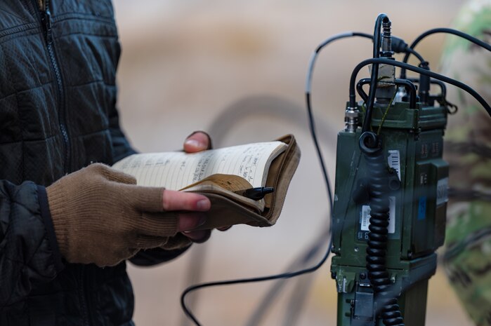 Airman reads notes