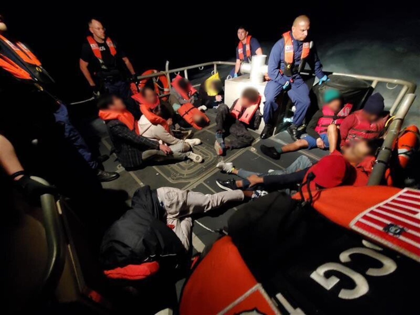 Coast Guard Station Miami Beach boat crews embarking aliens from a suspected smuggling venture in the Florida Straits, Feb. 12, 2025. One suspected smuggler was transferred to Homeland Security Investigations custody and the remaining 11 aliens were transferred to The Bahamas. (U.S. Coast Guard photo)