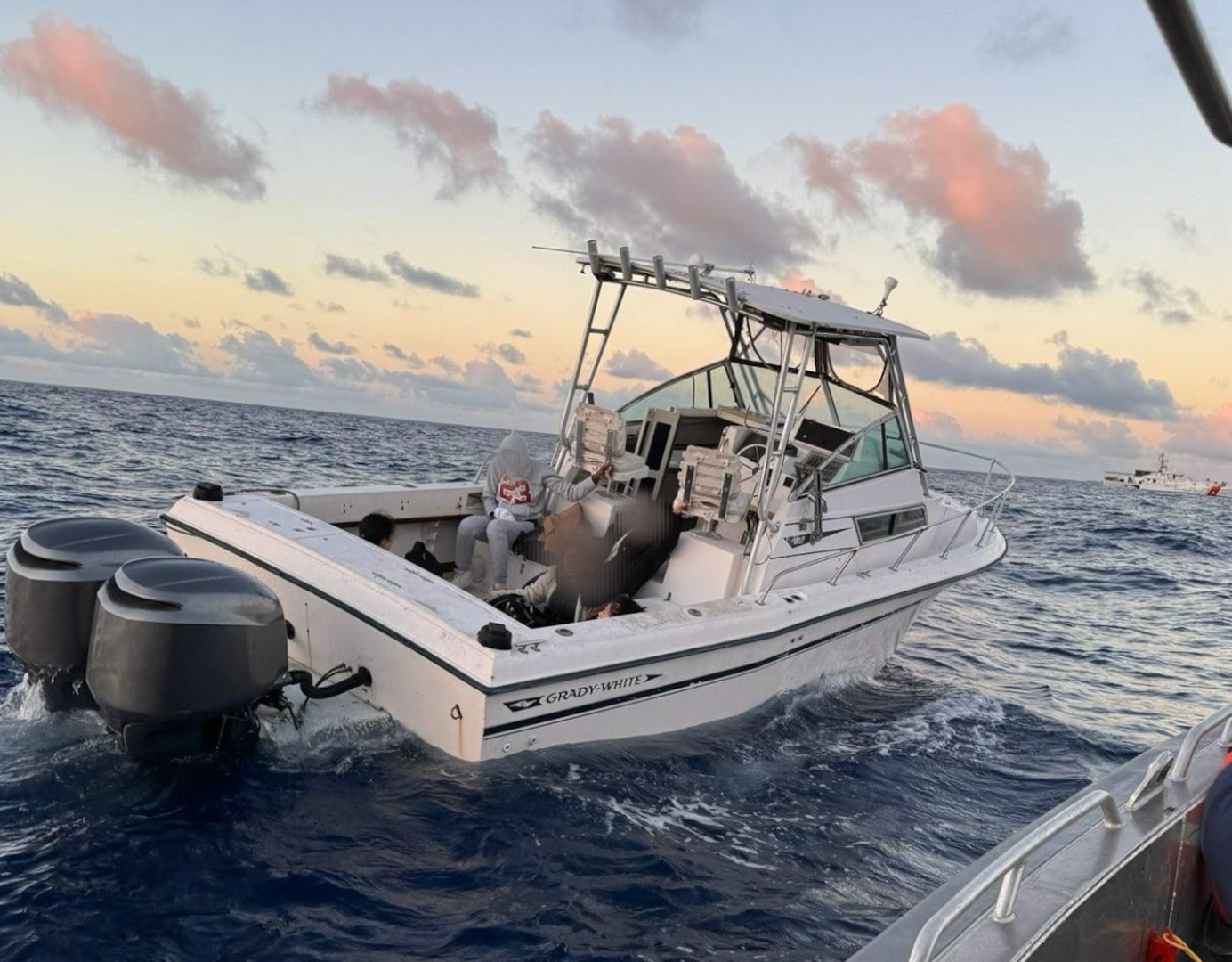 Customs and Border Protection Air and Marine Operations and Coast Guard boat crews interdicting a suspected smuggling venture in U.S. territorial waters, Feb. 9, 2025. Two on board were transferred to Homeland Security Investigations and the remaining 20 were returned to The Bahamas. (U.S. Coast Guard photo)