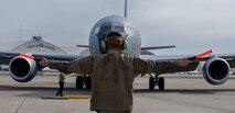 Man in front of airplane