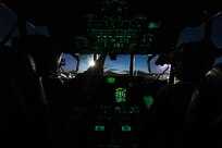 U.S. Air Force Capts. Zachary Norton and Steven Gilliam, 36th Airlift Squadron C-130J pilots, conduct a pre-flight check before conducting a night sortie at Yokota Air Base, Japan, Feb. 6, 2025.