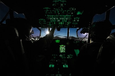 YOKOTA AIR BASE, TOKYO, Japan (Feb. 6, 2025) — U.S. Air Force Capts. Zachary Norton and Steven Gilliam, 36th Airlift Squadron C-130J pilots, conduct a pre-flight check before conducting a night sortie at Yokota Air Base, Japan, Feb. 6, 2025. Night time sorties, or night tacs, present unique challenges and provide pilots and loadmasters an opportunity to implement tactics and techniques under limited visibility. (U.S. Air Force photo by Staff Sgt. Spencer Tobler)