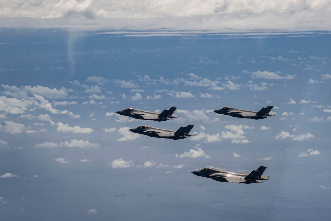A U.S. Air Force F-35A Lightning II is flanked from top to bottom by a Royal Australian Air Force F-35A, a Japan Air Self Defense Force F-35A and a U.S. Marine Corps F-35B Lightning II during a formation over the U.S. Indo-Pacific Command area of responsibility, Feb. 7, 2025.