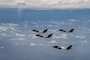 A U.S. Air Force F-35A Lightning II is flanked from top to bottom by a Royal Australian Air Force F-35A, a Japan Air Self Defense Force F-35A and a U.S. Marine Corps F-35B Lightning II during a formation over the U.S. Indo-Pacific Command area of responsibility, Feb. 7, 2025.