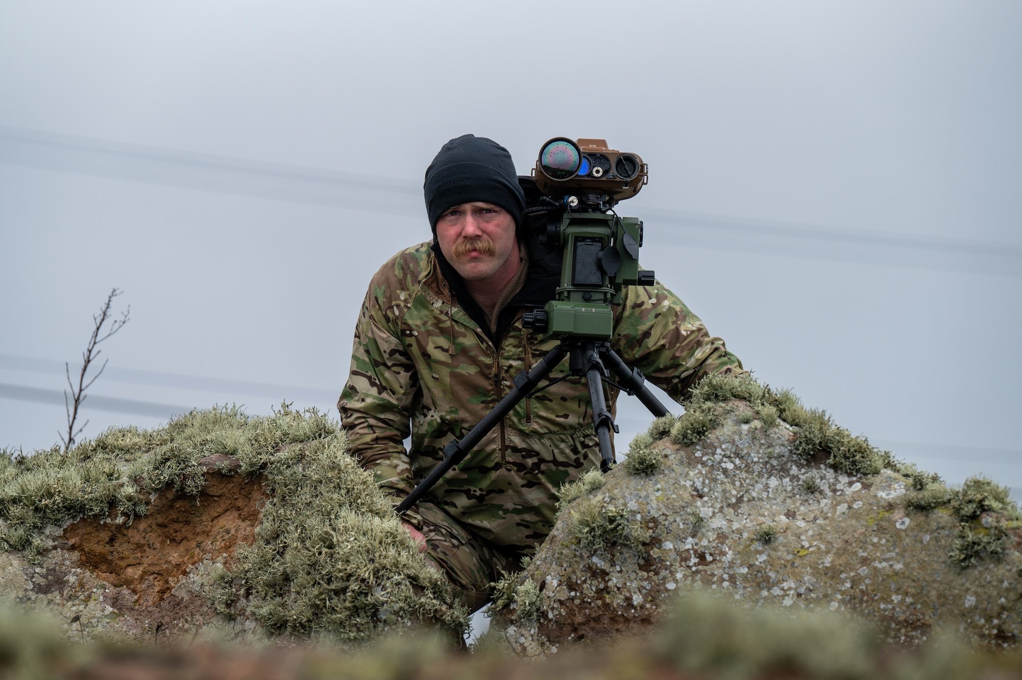 Airman stands near optics