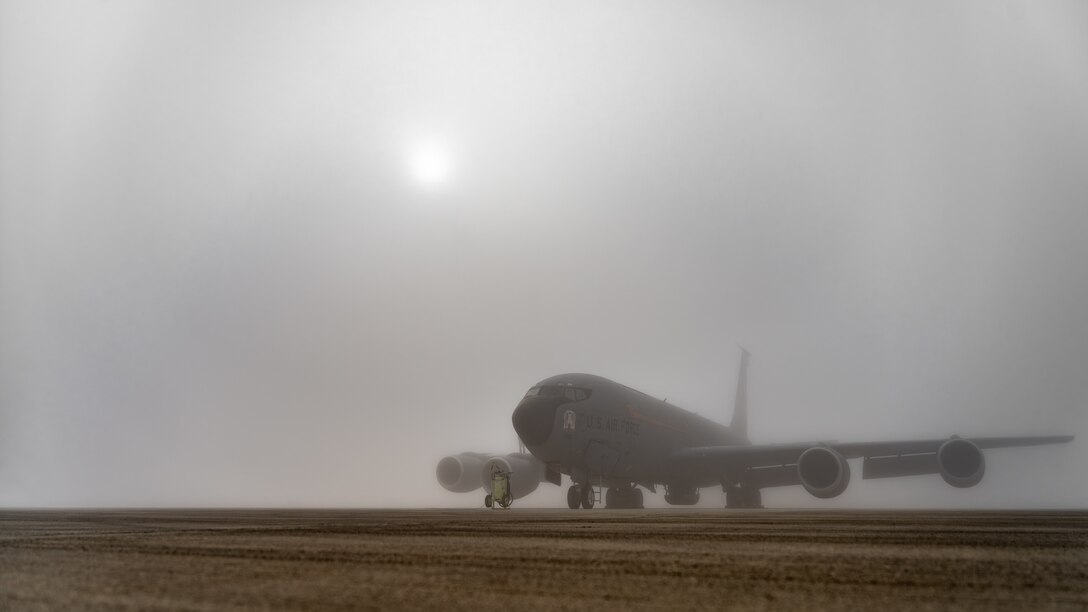 KC-135 on flightline in fog