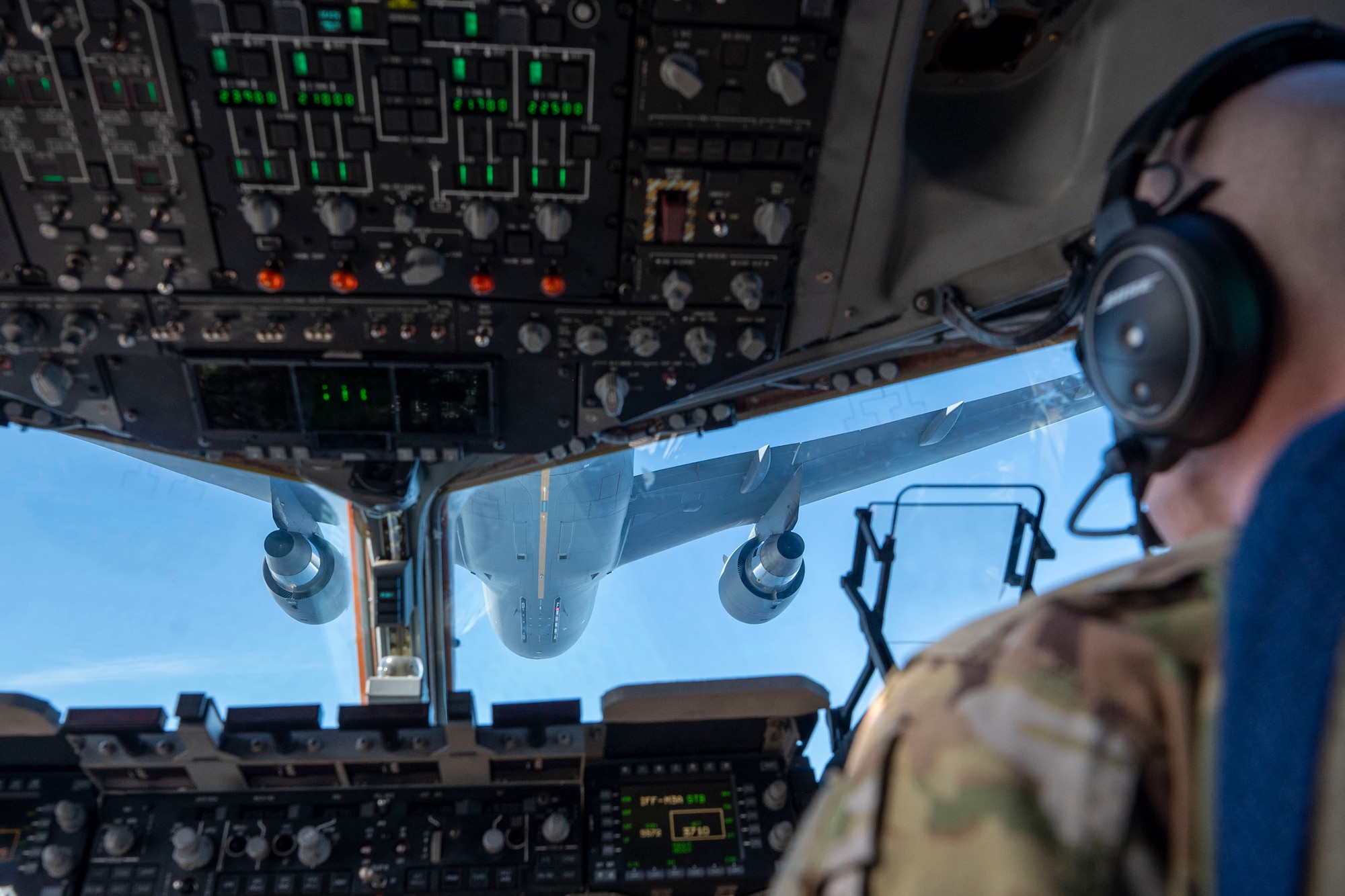 U.S. Air Force Maj. Jacob Pruitt, 7th Expeditionary Airlift Squadron pilot, conducts low-altitude aerial refueling training with a KC-46 Pegasus from the 305th Air Mobility Wing from Joint Base McGuire-Dix-Lakehurst while instructing pilots from the 517th Airlift Squadron from Joint Base Elmendorf in the Pacific region, Feb. 11, 2025.