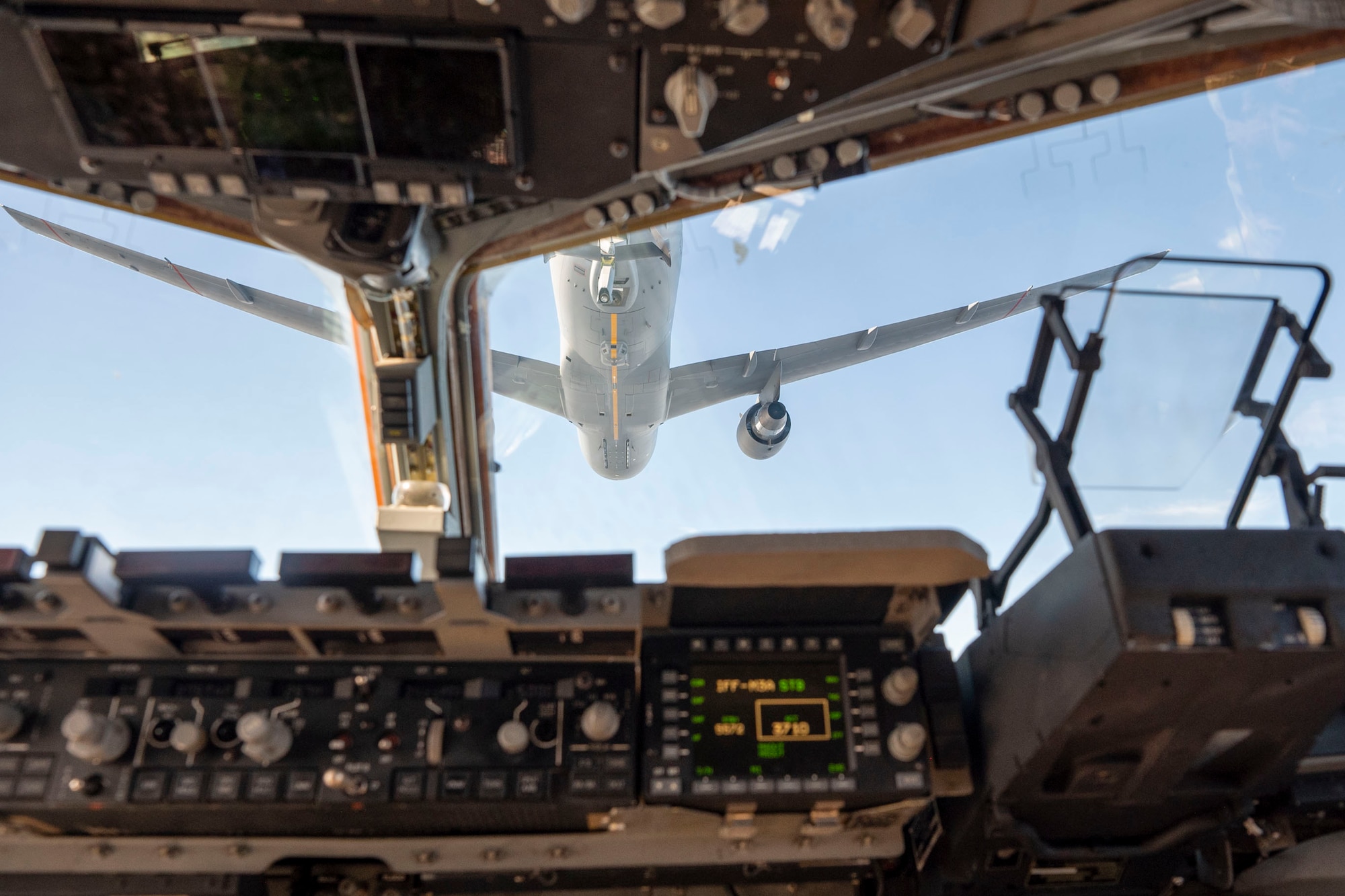 A KC-46 Pegasus assigned to the 305th Air Mobility Wing from Joint Base McGuire-Dix-Lakehurst conducts low-altitude aerial refueling with a C-17 Globemaster III assigned to the 7th Expeditionary Airlift Squadron at Joint Base Lewis-McChord, Washington, during Bamboo Eagle 25-1 in the Pacific region, Feb. 11, 2025.