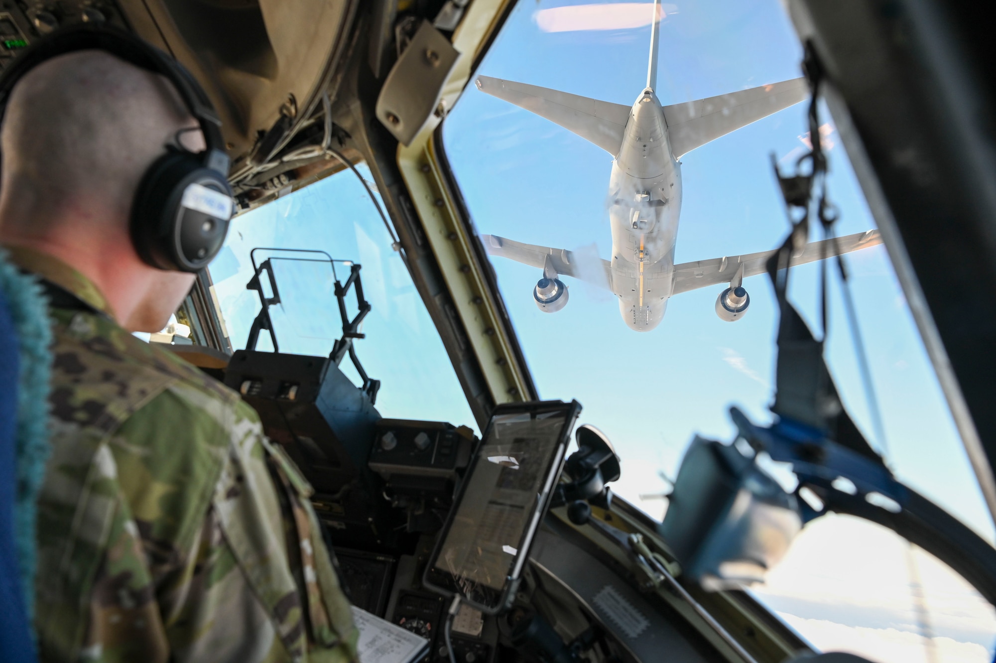 U.S. Air Force Maj. Jacob Pruitt, 7th Expeditionary Airlift Squadron pilot, conducts low-altitude aerial refueling training with a KC-46 Pegasus from 305th Air Mobility Wing from Joint Base McGuire-Dix-Lakehurst , while instructing pilots from the 517th Airlift Squadron from Joint Base Elmendorf in the Pacific region, Feb. 11, 2025.