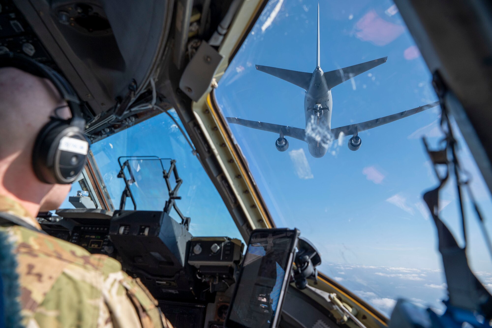 U.S. Air Force Maj. Jacob Pruitt, 7th Expeditionary Airlift Squadron pilot, conducts low-altitude aerial refueling training with a KC-46 Pegasus from 305th Air Mobility Wing from Joint Base McGuire-Dix-Lakehurst , while instructing pilots from the 517th Airlift Squadron from Joint Base Elmendorf in the Pacific region, Feb. 11, 2025.