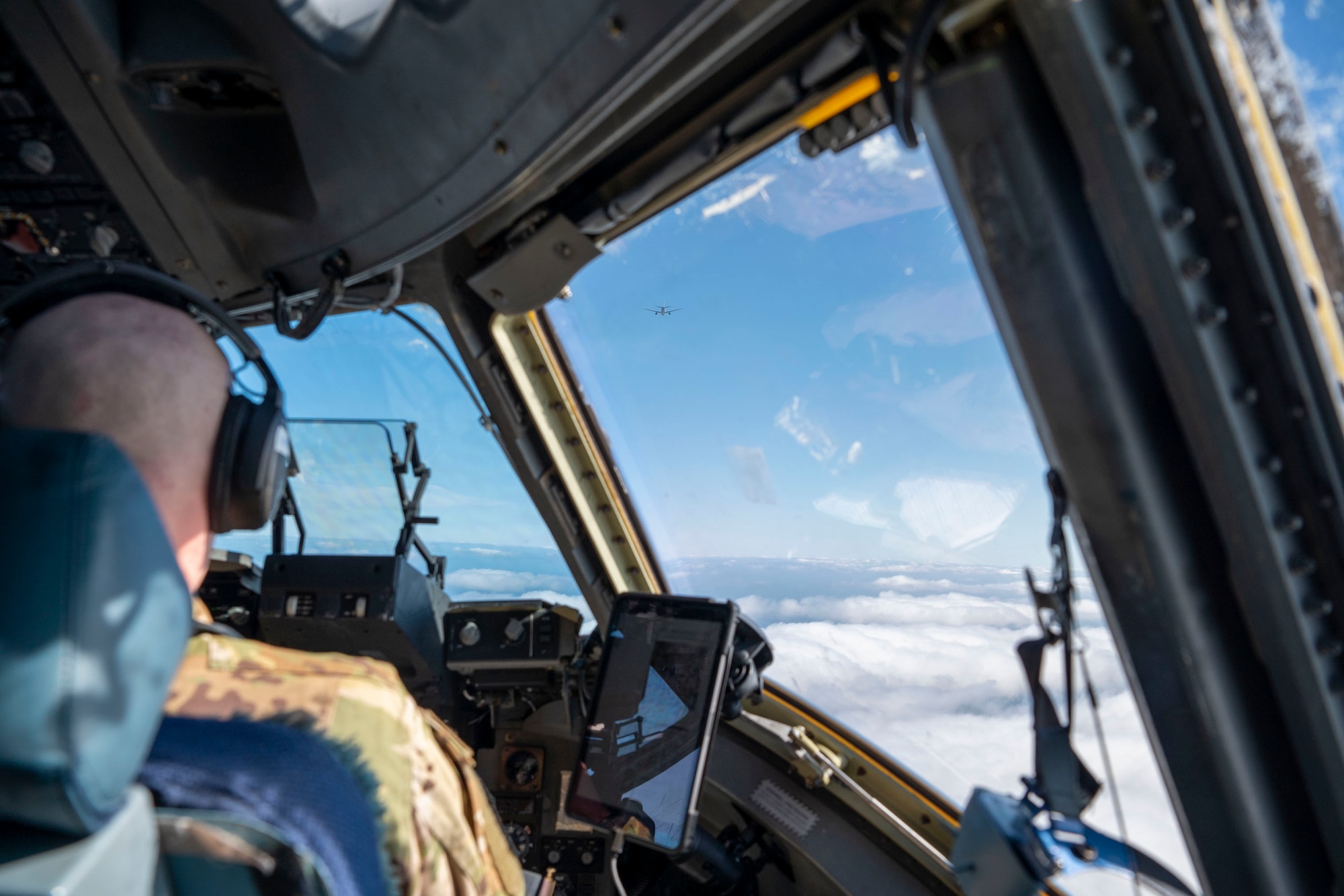 U.S. Air Force Maj. Jacob Pruitt, 7th Expeditionary Airlift Squadron pilot, conducts low-altitude aerial refueling training with a KC-46 Pegasus from 305th Air Mobility Wing from Joint Base McGuire-Dix-Lakehurst , while instructing pilots from the 517th Airlift Squadron from Joint Base Elmendorf in the Pacific region, Feb. 11, 2025.