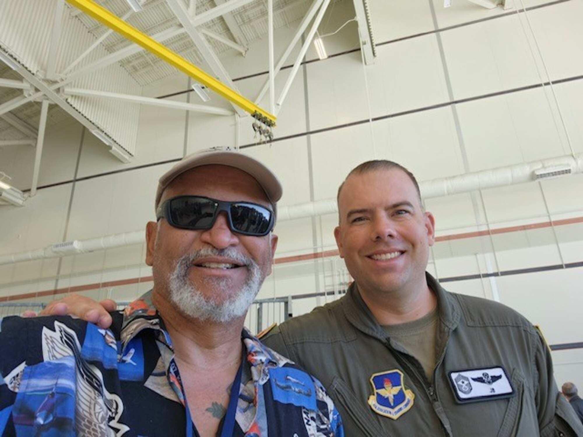 U.S. Air Force Chief Master Sgt. Justin Brundage, 97th Air Mobility Wing command chief, right, and retired Chief Master Sgt. Lou Drummond take a selfie at the KC-10 Extender aircraft farewell at Travis Air Force Base, California, Sept. 26, 2024. Drummond was Brundage’s first mentor in his Air Force career. (U.S. Air Force Photo by Airman 1st Class Jonah Bliss)