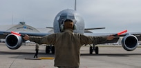 Man in front of airplane