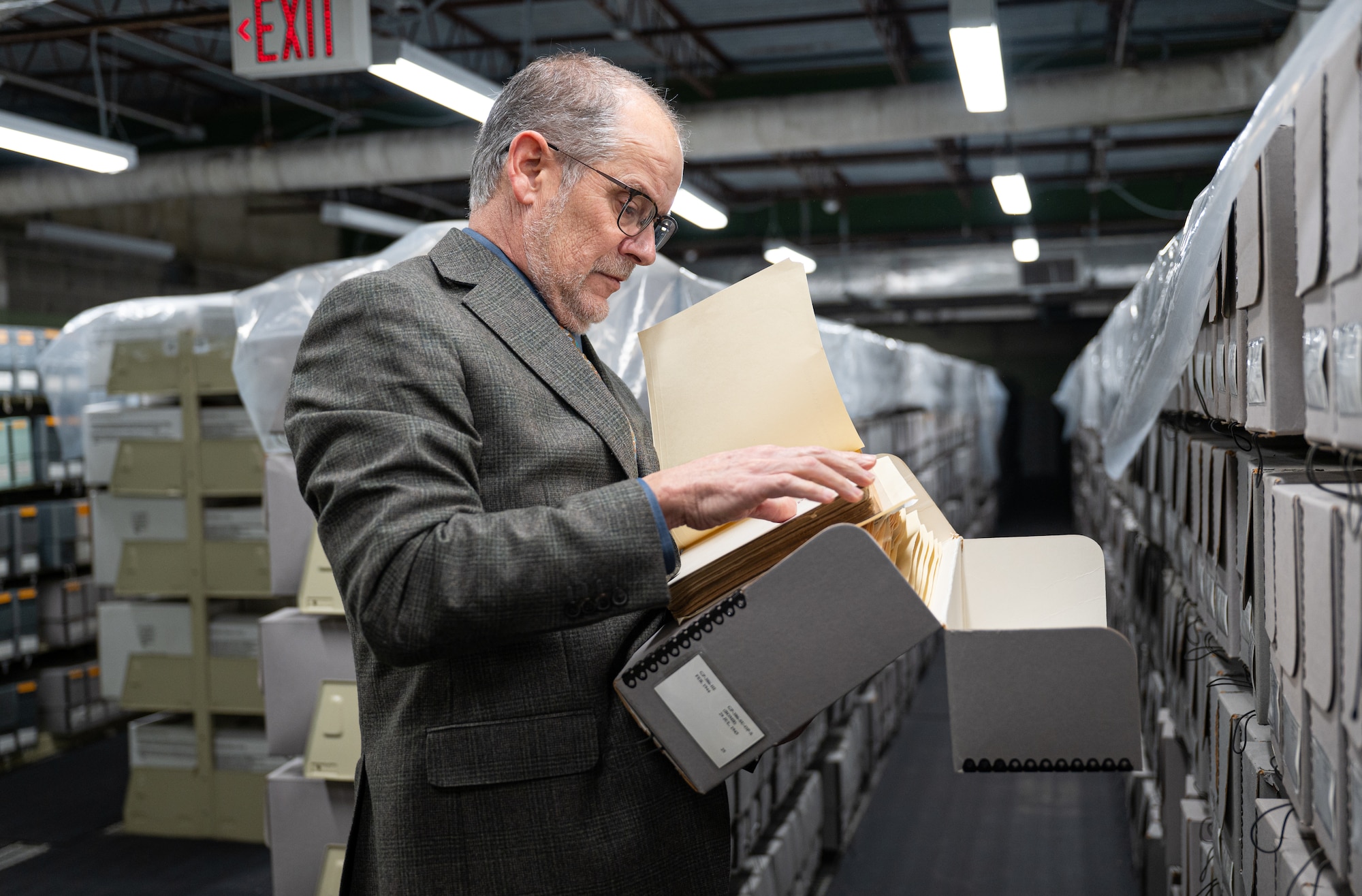 Timothy Brown, Air Force Historical Research Agency director, observes documents at Maxwell Air Force Base, Alabama, Feb. 12, 2025.