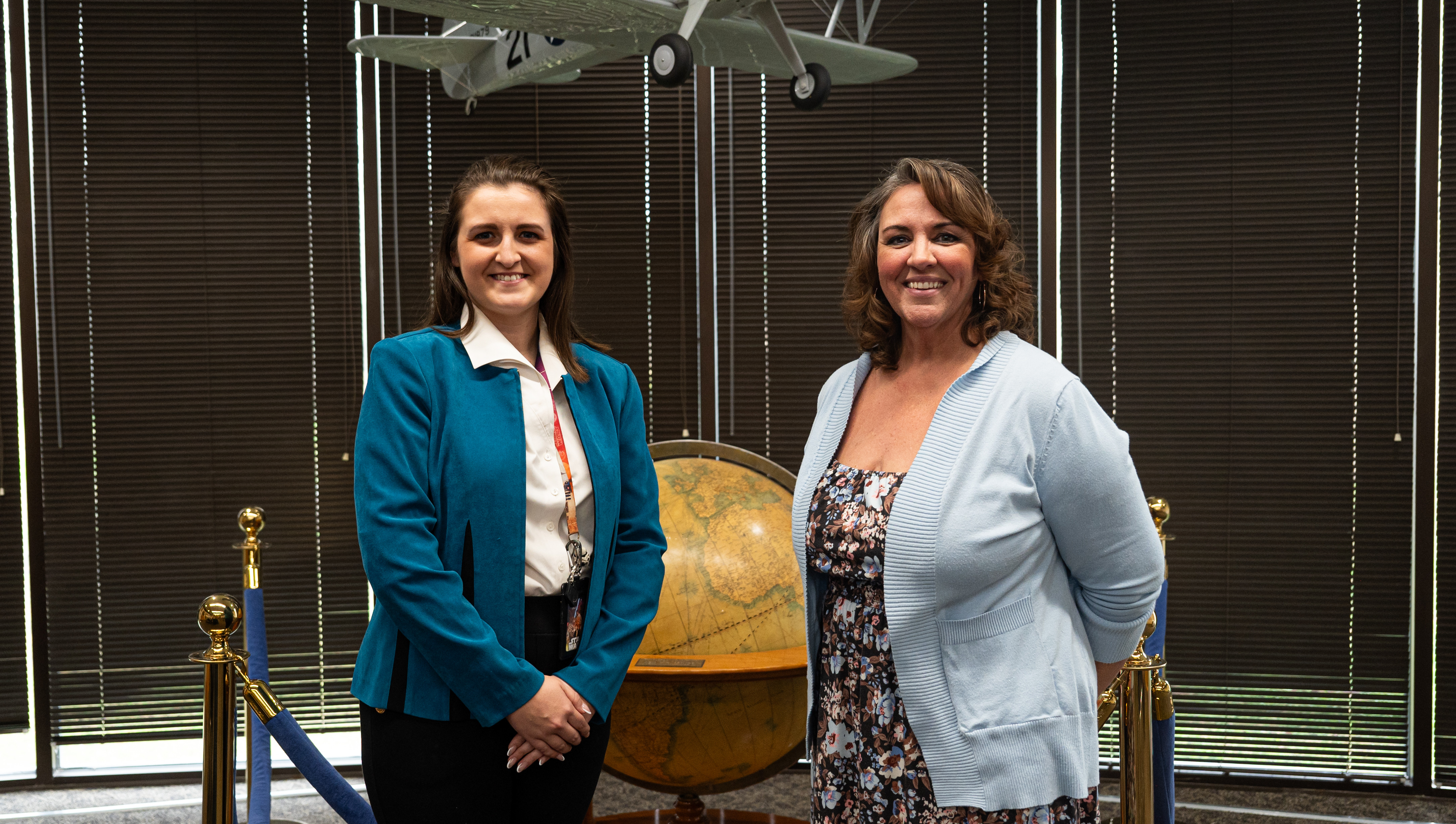 Elizabeth Meads left, Archives technician and Melissa Lahue, Research Division chief of the Air Force Historical Research Agency, pose for a photo at Maxwell Air Force Base, Alabama, Feb. 12, 2025. The agency serves the Department of the Air Force, preserving history through a vast collection of documents, personal records and historical papers since its establishment in 1943. (U.S. Air Force photo by Senior Airman Elizabeth Figueroa.)