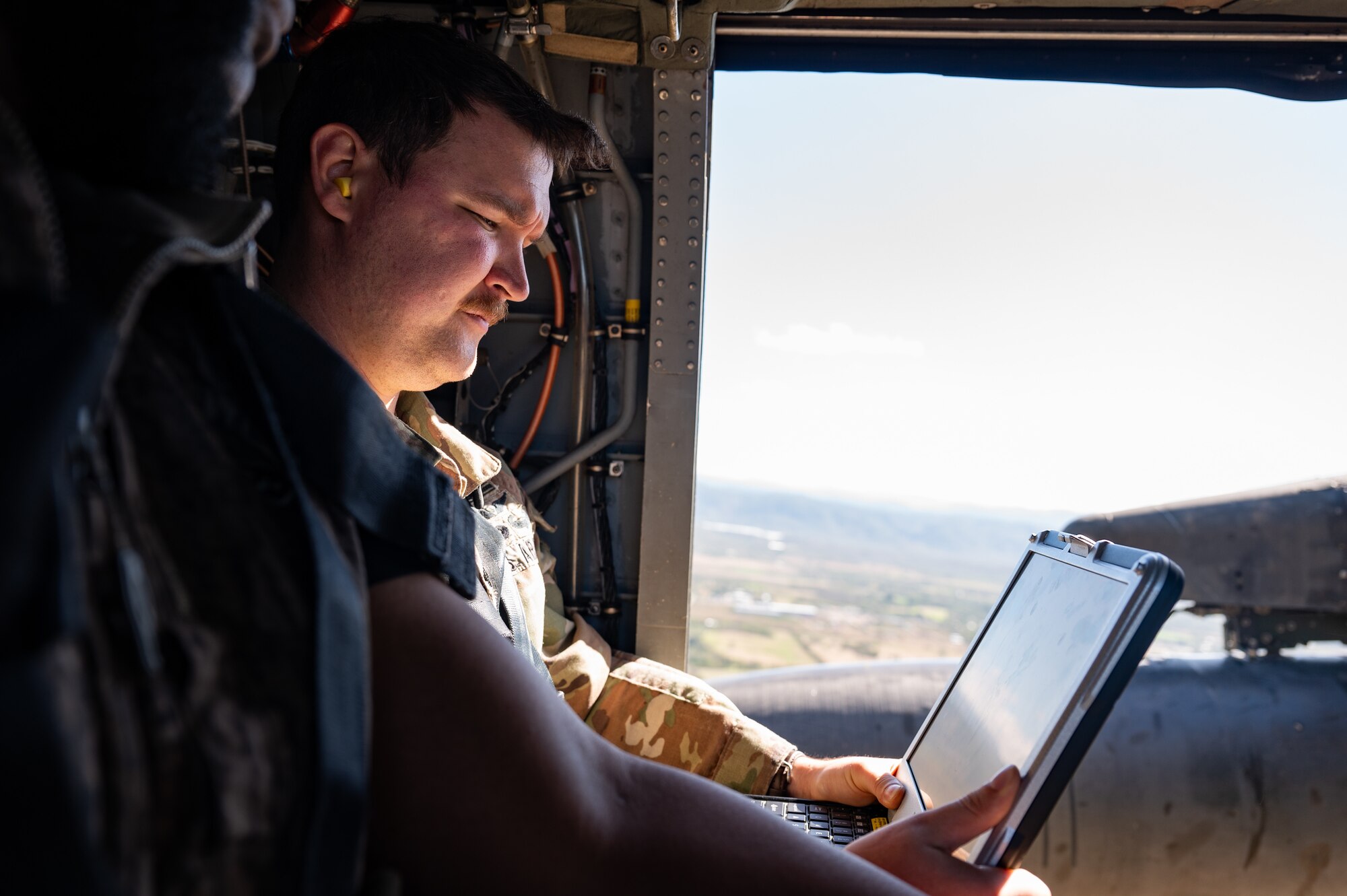 U.S. Army 1st Lt. Micah Feltenstein, Joint Task Force-Bravo engineering directorate (J7) project officer, monitors a computer displaying the terrain of areas around Soto Cano Air Base, Honduras, during the Automated Route Reconnaissance Kit training February 6, 2025. Due to JTF-Bravo’s helicopter capabilities, the ARRK can help members recon routes and locations for humanitarian assistance and disaster relief missions. (U.S. Air Force photo by Staff Sgt. Tristan Biese)