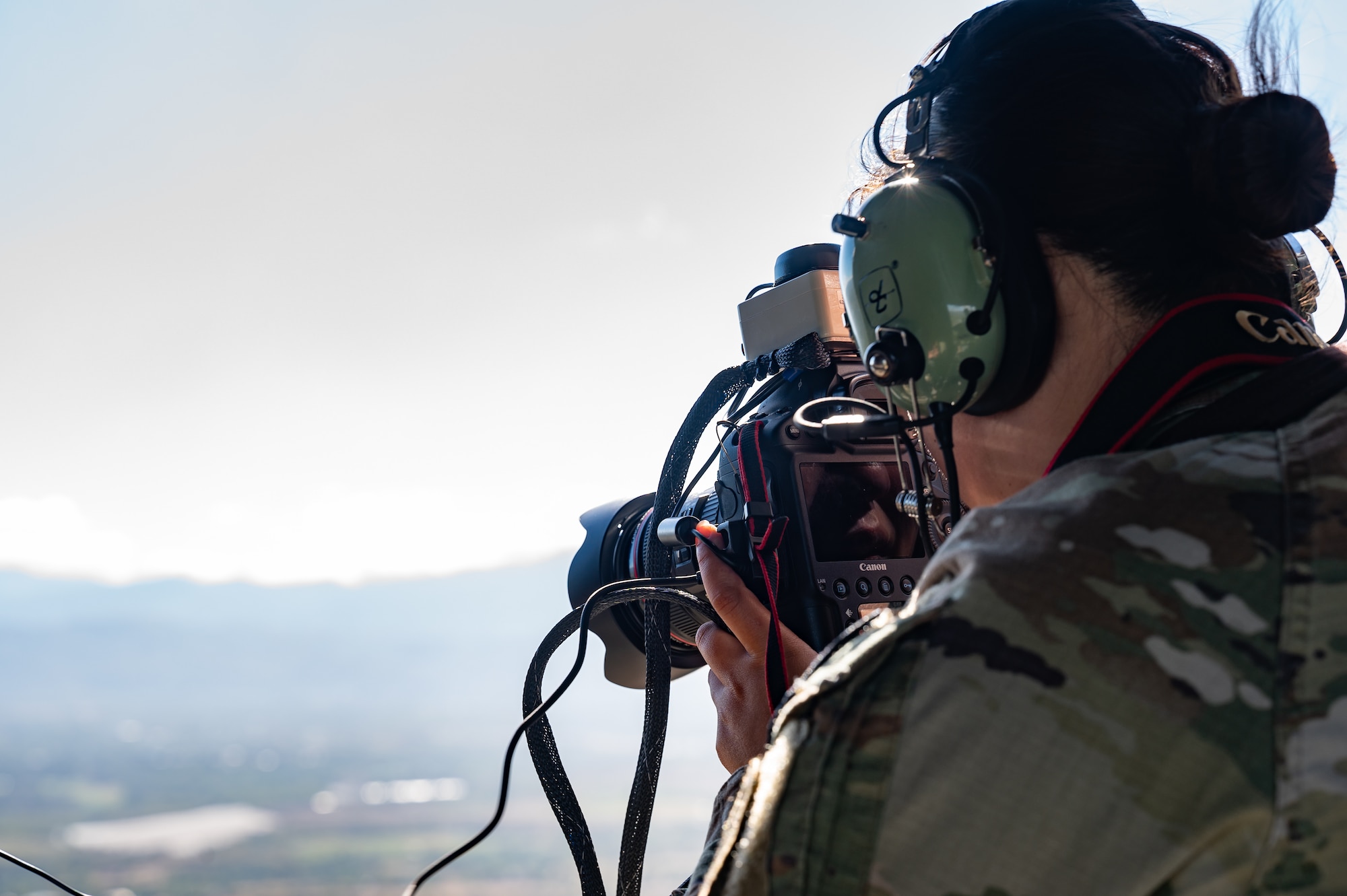 U.S. Army 1st Lt. Youna Steves, Joint Task Force-Bravo engineering directorate (J7) project officer, takes photos of the terrain of areas around Soto Cano Air Base, Honduras, during the Automated Route Reconnaissance Kit training February 6, 2025. The ARRK was created by the U.S. Army Corps of Engineers Reachback Operations Center to be a simple to use platform that assists in rapidly executing mounted reconnaissance assessments. (U.S. Air Force photo by Staff Sgt. Tristan Biese)