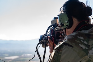 U.S. Army 1st Lt. Youna Steves, Joint Task Force-Bravo engineering directorate (J7) project officer, takes photos of the terrain of areas around Soto Cano Air Base, Honduras, during the Automated Route Reconnaissance Kit training February 6, 2025. The ARRK was created by the U.S. Army Corps of Engineers Reachback Operations Center to be a simple to use platform that assists in rapidly executing mounted reconnaissance assessments. (U.S. Air Force photo by Staff Sgt. Tristan Biese)