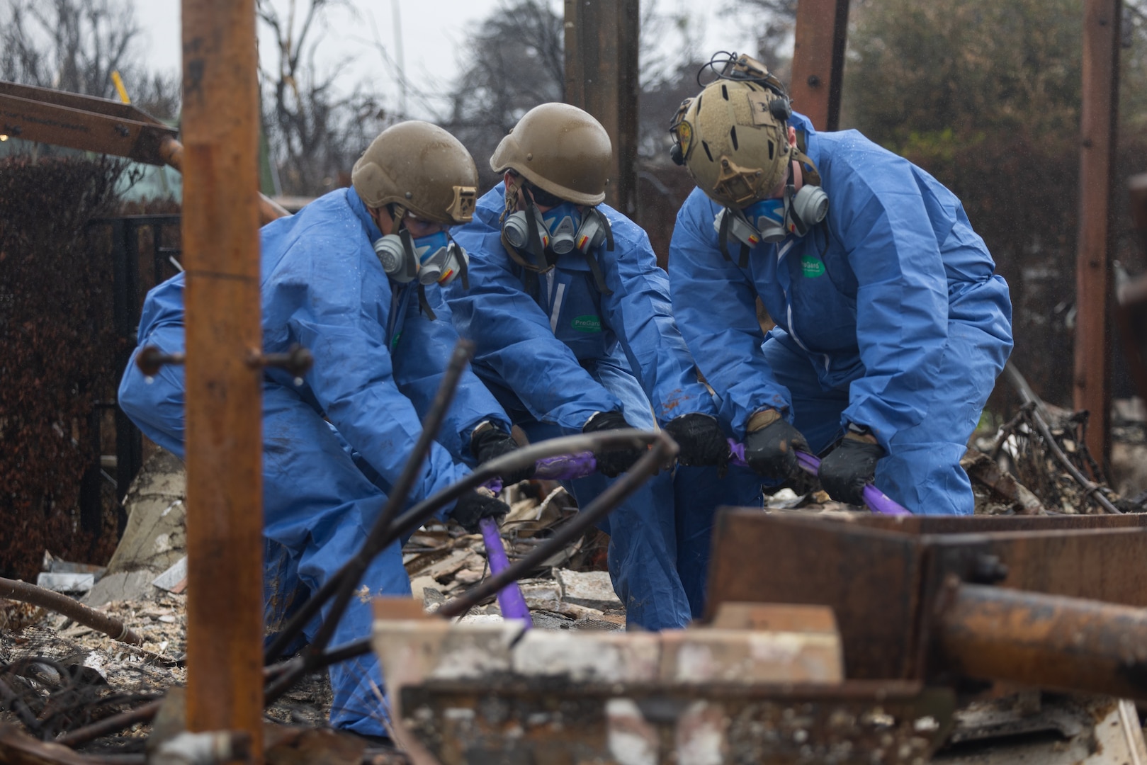 U.S. Marines with 1st Marine Logistics Group overlook debris as a part of disaster relief efforts due to the damages from the Los Angeles wildfires at Burbank, California, Feb. 12, 2025. At the request of the Federal Emergency Management Agency, U.S. Northern Command (NORTHCOM) deployed approximately 170 active-duty personnel to assist Environmental Protection Agency led teams with cleanup of wildfire hazardous waste from the Eaton and Palisades fires in California. U.S. Army North, U.S. Northern Command’s Joint Force Land Component Command, is overseeing the military’s support to federal and state efforts while Joint Task Force Civil Support is providing on-the-ground command and control of active-duty personnel. Work to remove the hazardous materials is phase 1 of the federal cleanup response to ensure the safety of the residents by preventing these materials from being released into the environment.