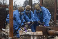 U.S. Marines with 1st Marine Logistics Group overlook debris as a part of disaster relief efforts due to the damages from the Los Angeles wildfires at Burbank, California, Feb. 12, 2025. At the request of the Federal Emergency Management Agency, U.S. Northern Command (NORTHCOM) deployed approximately 170 active-duty personnel to assist Environmental Protection Agency led teams with cleanup of wildfire hazardous waste from the Eaton and Palisades fires in California. U.S. Army North, U.S. Northern Command’s Joint Force Land Component Command, is overseeing the military’s support to federal and state efforts while Joint Task Force Civil Support is providing on-the-ground command and control of active-duty personnel. Work to remove the hazardous materials is phase 1 of the federal cleanup response to ensure the safety of the residents by preventing these materials from being released into the environment.