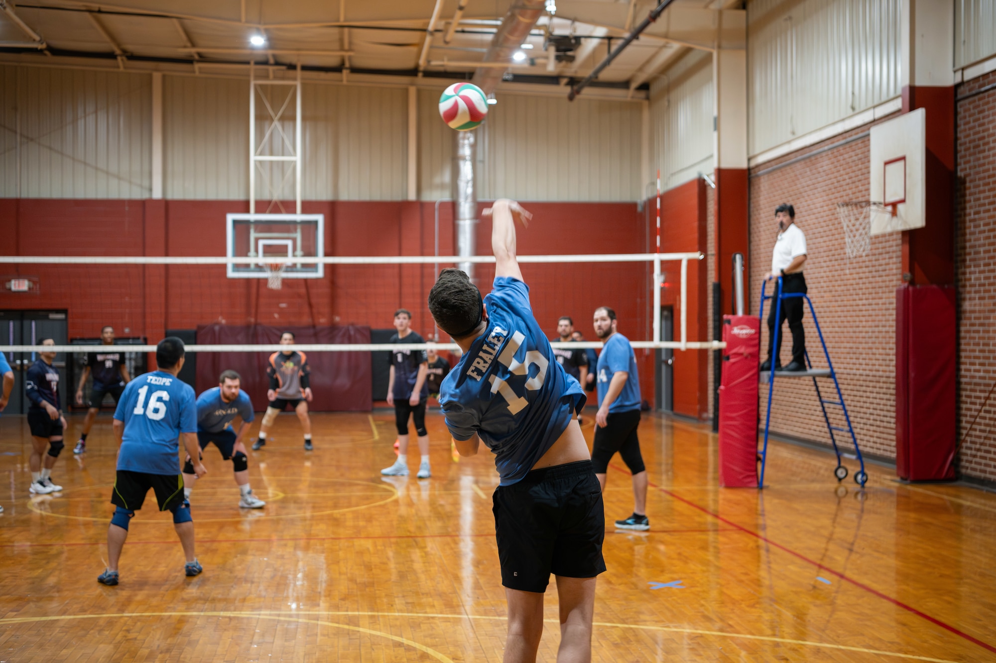 Arnold AFB team member John Fraley serves the ball during a volleyball match at the Tullahoma High School, Tullahoma, Tenn., Jan. 18, 2025. Arnold Air Force Base hosted a regional volleyball tournament featuring seven teams from various Air Force Bases, including Dover, Scott, Langley, Whiteman, Arnold, McGuire, and Seymour-Johnson. (U.S. Air Force photo by Keith Thornburgh