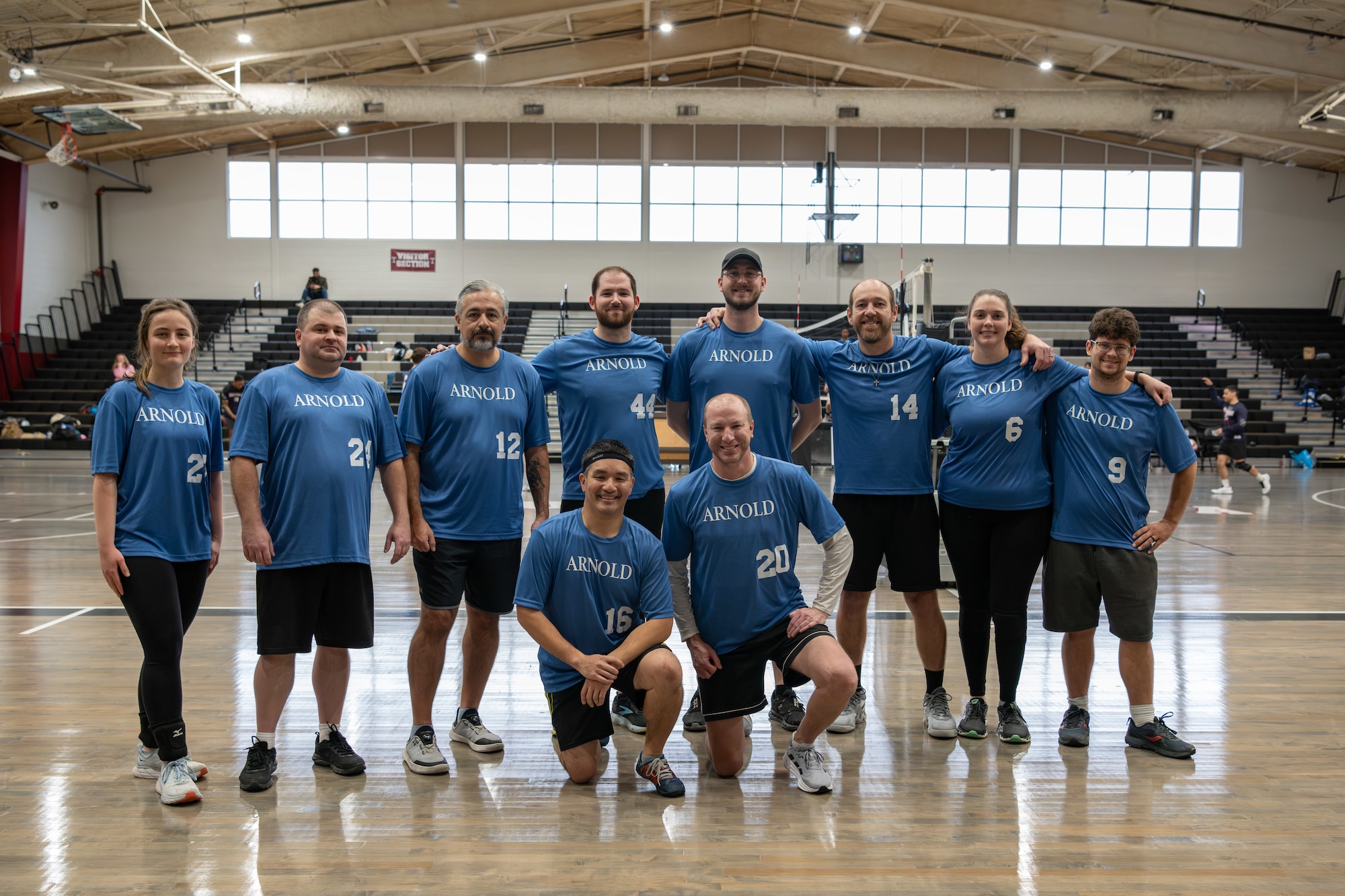 The Arnold Air Force Base Volleyball team poses for a team photo after a match at the Tullahoma High School, Tullahoma, Tenn., Jan. 19, 2025. Standing from left are team members Jocelyn Snodgrass, Scott Glennon, Carlos Chavez, Austin Sherman, Daniel Gothard, Josh Cooke, Kristen Erickson, and Kyle League. Kneeling from left is Kaz Teope and Brian Babis. Arnold Air Force Base participated in a regional volleyball tournament featuring seven teams from various Air Force Bases, including Dover, Scott, Langley, Whiteman, Arnold, McGuire, and Seymour-Johnson. (U.S. Air Force photo by Keith Thornburgh)