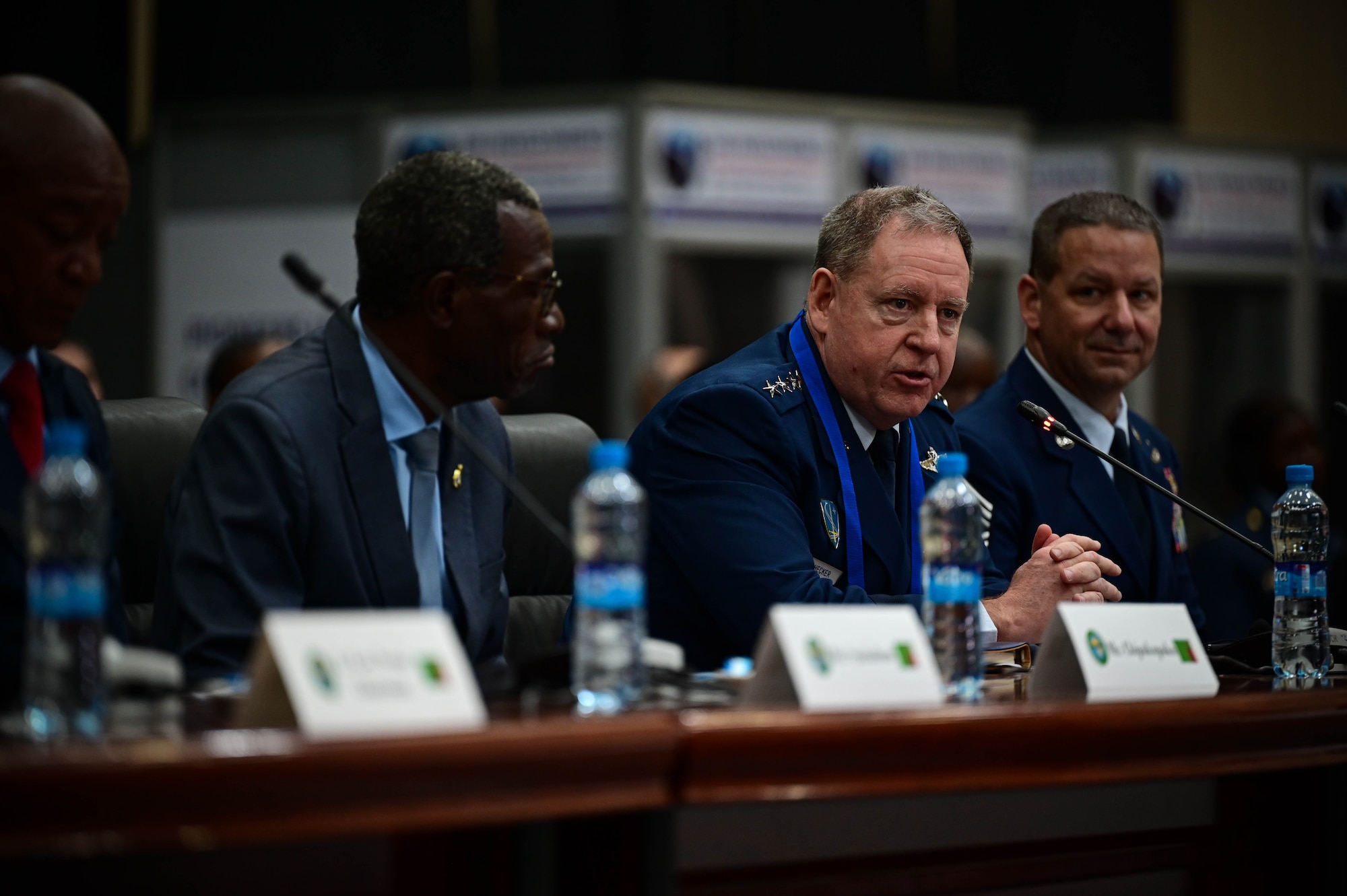 Gen Hecker sits at a table ready to engage.