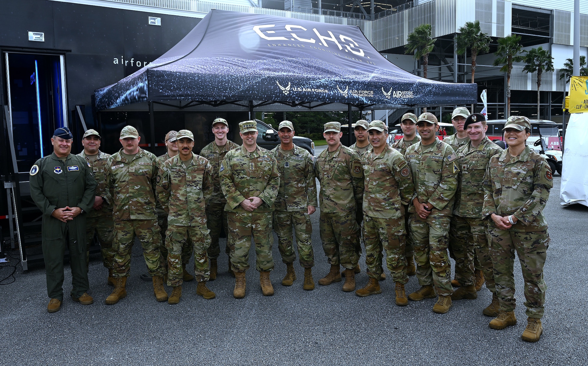Service members stand for a group photo.