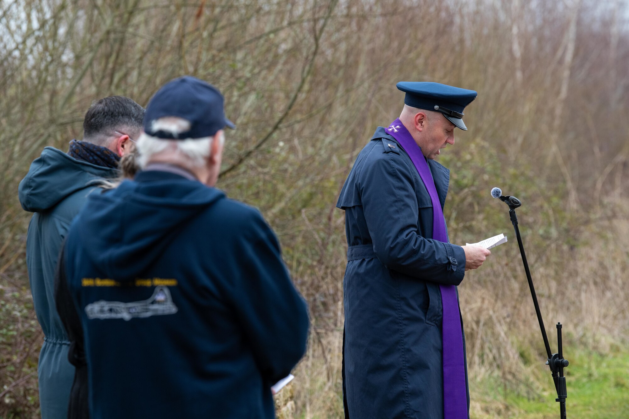 A Chaplain give the invocation during a memorial ceremony