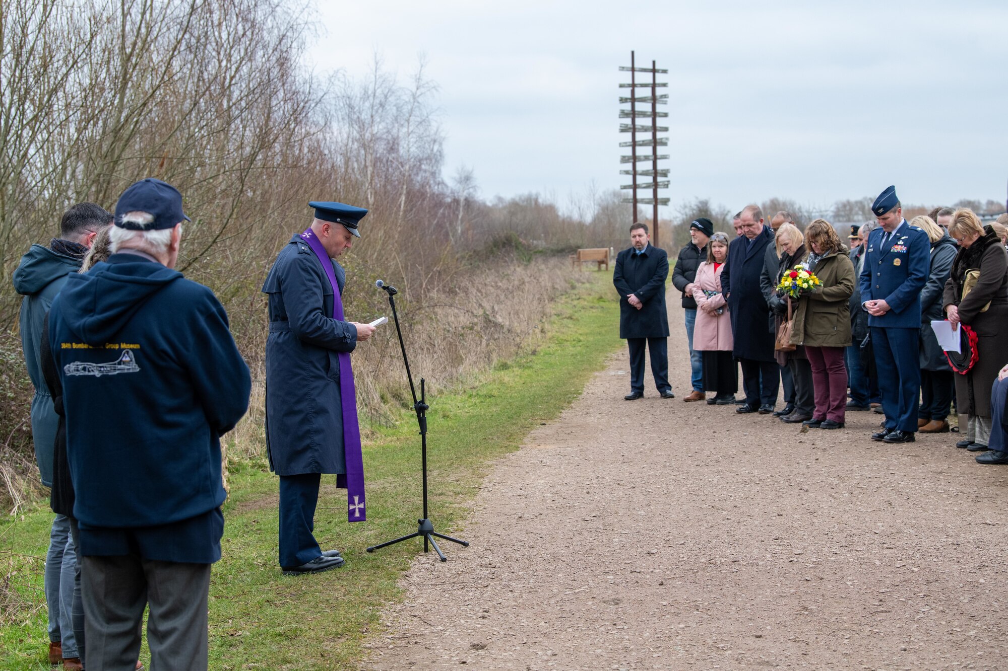 A Chaplain delivers the invocation during a memorial ceremony